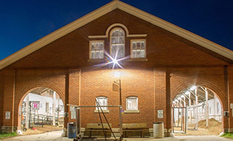 The Cattle Barn with lights at night