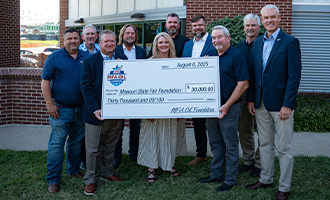 MFA Oil with a giant check to the MSF Foundation