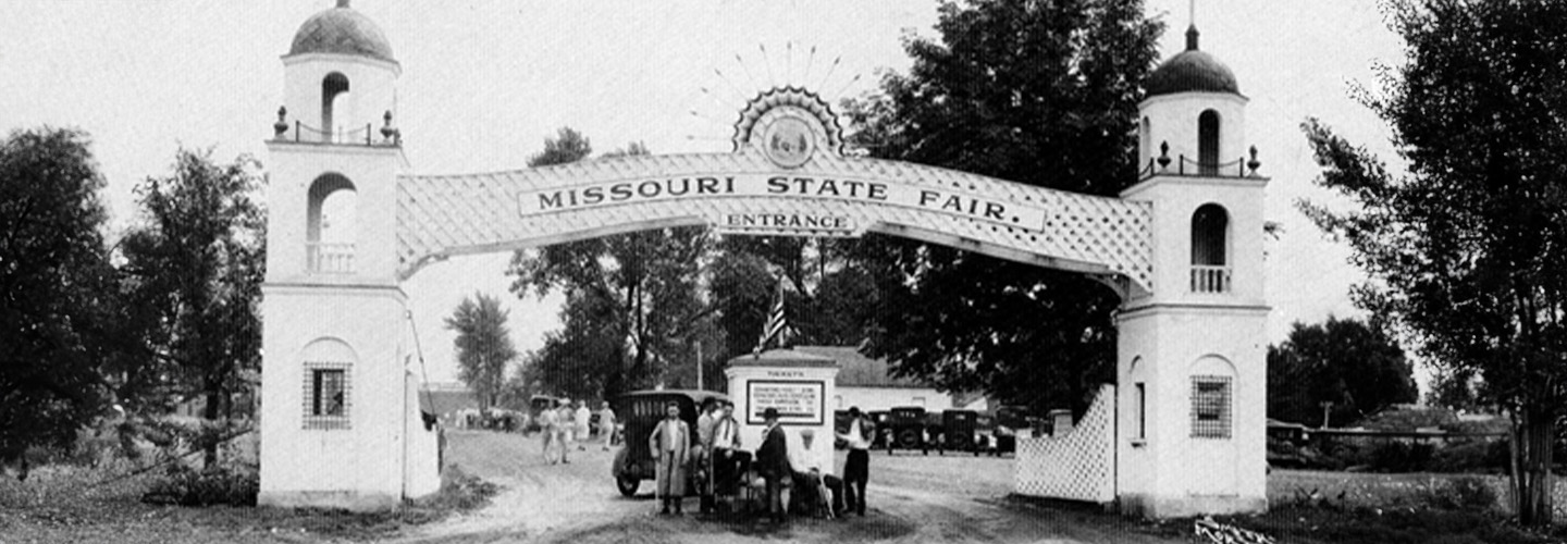 Historic black and white photo of the main gate at the fairgrounds