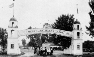 Historic black and white photo of the main gate at the fairgrounds