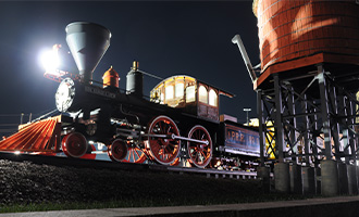 The Trail's End landmark at night