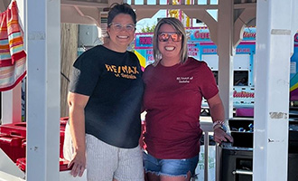 Two volunteers selling water to raise money for the foundation